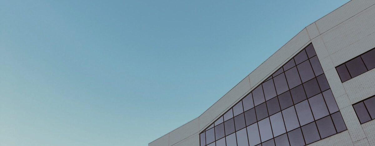 Commercial roofing contractors working on a large flat